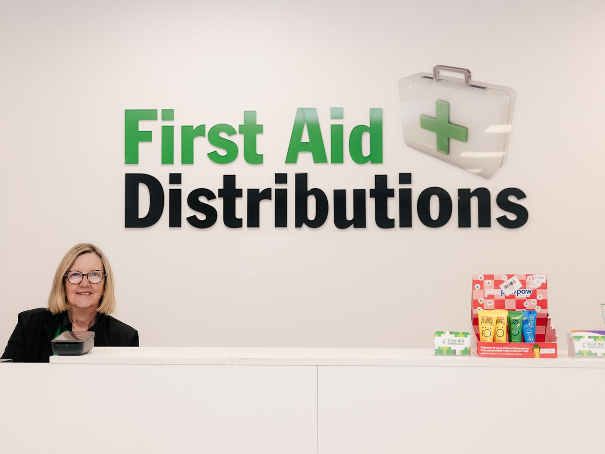 Kim Hando at the counter of the Comfort First and First Aid Distributions store in East Bendigo