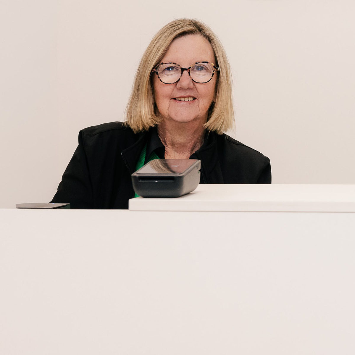 Kim Hando at the counter of the Comfort First store, 205 Murphy Street, East Bendigo